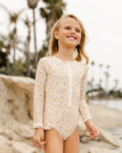 Load image into Gallery viewer, Long Sleeve rashguard one piece with ruffle around the waist and a floral print.