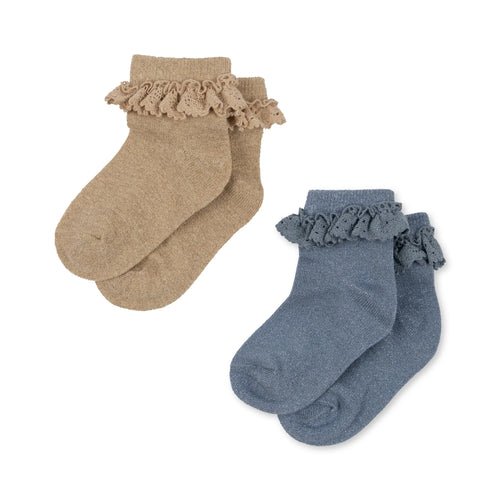 2 pack of children's socks featuring a blue pair and a sand coloured pair, both having a decorative shimmer to them and a lace ruffle around the ankle. 