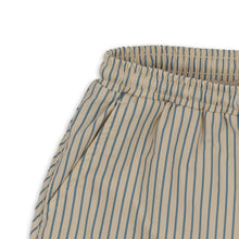 Load image into Gallery viewer, Cream coloured children&#39;s swim shorts featuring a vertical blue stripe pattern.
