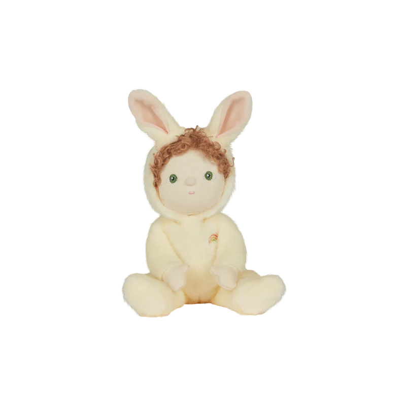 Babbit the bunny plush toy is featuring a cream onesie with bunny ears on the hood and blonde curly hair. 