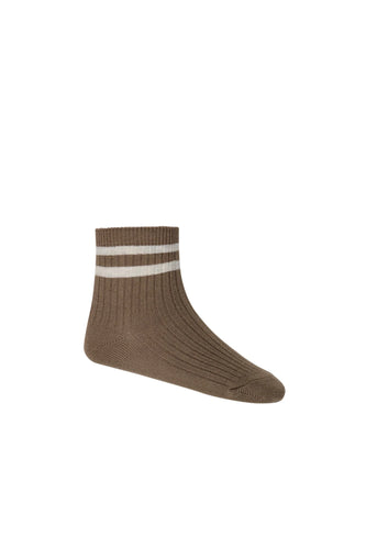 Brown children's sock with two cream stripes around the ankle. 
