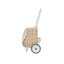 Load image into Gallery viewer, Rattan basket on wheels with a circular shape, handle, and a lining that pops out to mimic bunny ears.
