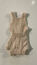 Load image into Gallery viewer, Knit beige romper with straps crossing in the back with buttons. 
