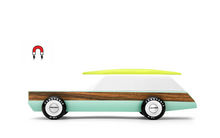 Load image into Gallery viewer, Wooden Toy Car with magnetic surfboard on the top. The car also has a wooden stripe along the turquoise side. 
