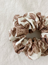 Load image into Gallery viewer, Beige linen scrunchie featuring pink and beige florals.
