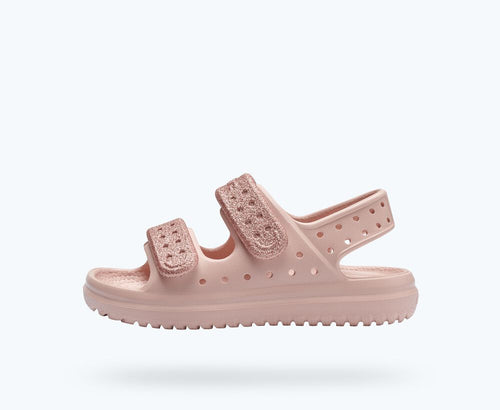 Pastel Pink sandals from Native Shoes featuring two sparkly pink adjustable straps for a snug fit.