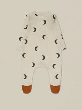 Load image into Gallery viewer, Organic Cotton beige baby onesie with contrast rust feet attached and a dark blue moon print all over.
