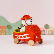 Load image into Gallery viewer, A fireman dog plush toy made from a wool blend. Comes with a wool plush car and removable hat.
