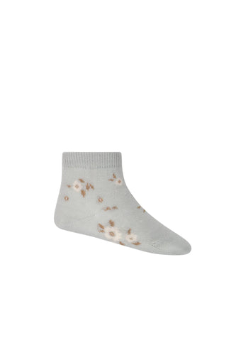 Baby blue children's organic cotton sock with white floral print. 