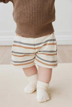 Load image into Gallery viewer, Beige shorts with blue and rust stripes.
