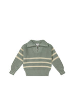 Load image into Gallery viewer, Baby teal knit sweater with quarter zip and three white stripes across middle. 
