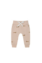 Load image into Gallery viewer, Organic Cotton track pant from Jamie Kay. Beige sweatpant with dogs print. 
