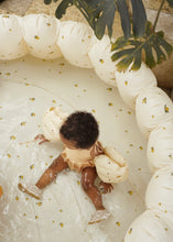 Load image into Gallery viewer, Large shell inflatable pool featuring a cream colour and an all over lemon print. 
