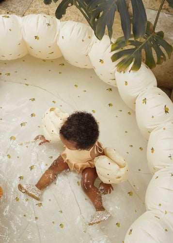 Large shell inflatable pool featuring a cream colour and an all over lemon print. 