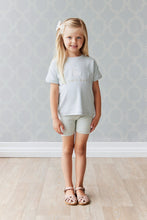 Load image into Gallery viewer, Baby Blue children&#39;s bike shorts with a white floral all over print.
