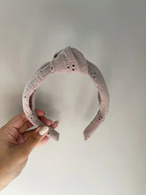 Load image into Gallery viewer, Mauve lace fabric on a structured headband featuring a knot at the top.
