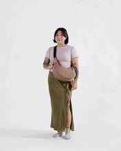 Load image into Gallery viewer, Beige crossbody crescent bag with a black strap. The whole bag is made of ripstop nylon.
