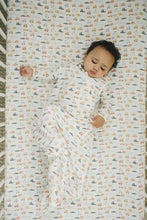Load image into Gallery viewer, Camper Van print featuring red, yellow, blue, and navy vans on a lightweight baby sleep bag.
