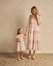 Load image into Gallery viewer, This dress has a soft flower print, cute short sleeves, and dainty front ties featuring a french hydrangea pink all over print on an ivory base.
