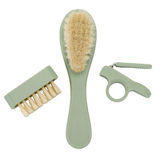 Baby Grooming Kit including a hairbrush, clippers, and a nail brush.