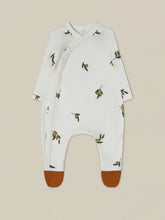Load image into Gallery viewer, Organic cotton light beige onesie with contrast rust feet and an olive branch all over print. 
