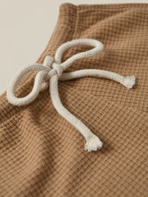 Load image into Gallery viewer, Terracotta Clay coloured shorts with a waffle fabric.
