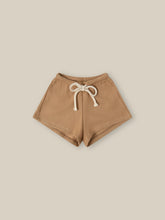 Load image into Gallery viewer, Terracotta Clay coloured shorts with a waffle fabric. 
