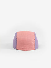 Load image into Gallery viewer, Baby cap featuring a five panel colour-block design. The colour-block design features a pink, purple, yellow, and cream.
