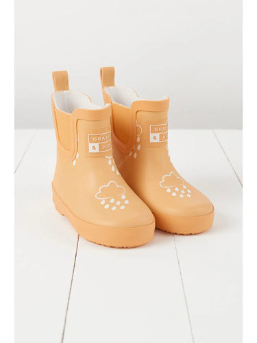 Peach coloured short rain boots lined with teddy fleece. 
