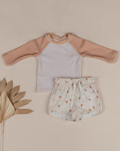 Load image into Gallery viewer, Beige coloured baby swim shorts featuring an oranges all over print.
