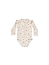 Load image into Gallery viewer, Beige coloured baby one piece rash guard with zipper on the front and ruffles on the shoulders. This rash-guard is featuring an oranges all over print. 
