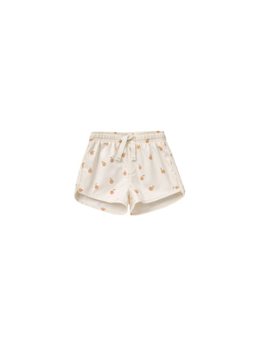 Beige coloured baby swim shorts featuring an oranges all over print. 