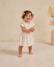 Load image into Gallery viewer, Beige coloured baby dress with ruffle sleeves and three tiers on the skirt. This dress features an oranges all over print.
