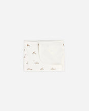 Load image into Gallery viewer, Quincy Mae 100% organic cotton baby swaddle blanket in ivory featuring an all-over bunny print.
