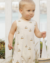 Load image into Gallery viewer, Cream coloured baby jumpsuit with a sailboat all over print.
