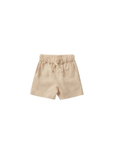 Load image into Gallery viewer, Linen blend children shorts featuring a warm beige colour. 
