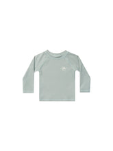 Load image into Gallery viewer, Long Sleeve rash guard in a seafoam colour. This rash guard also features a R + C along with a half sun in the top left corner of front. 
