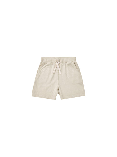 Beige sweat short with a drawstring waistband. 