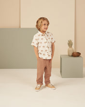 Load image into Gallery viewer, Cream collard linen baby shirt with warm beige palm tree all over print.
