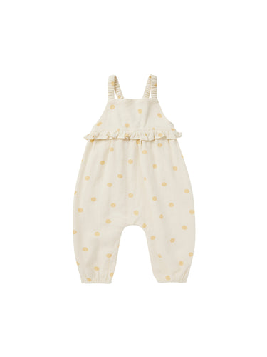 This sleeveless jumpsuit has full length pants with elastic openings, gathered peplum on the empire waistline, and gathered elastic straps.  Featuring a yellow polka dot print. 