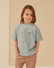 Load image into Gallery viewer, Cotton children&#39;s tee featuring a blue colour and a surfboard graphic

