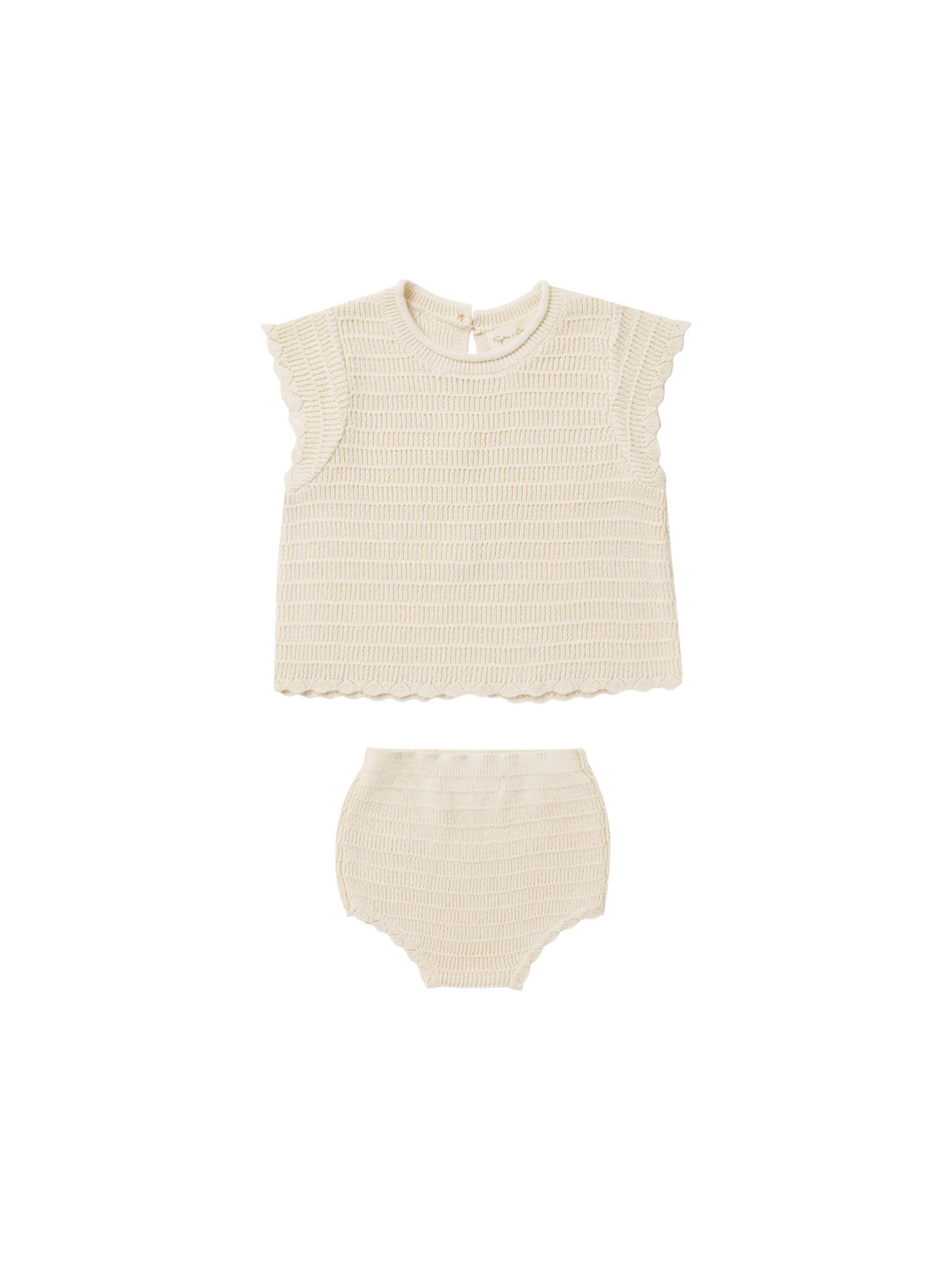 This crochet knit set has all the throwback vibes with scalloped short sleeves and edges, buttons on back with opening on bottom half, and coordinating bloomers with scalloped edges and a beige colour. 