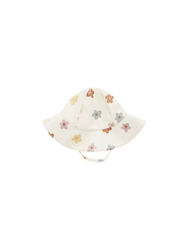 White floppy sun hat featuring a colourful floral all over print. 