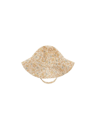 This floppy sun hat is the perfect summer essential. Rim lined with water resistant fabric and featuring self ties so the hat stays put.  Featuring a blossom all over pattern