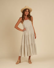Load image into Gallery viewer, A cream and blue stripe linen blend featured on a maxi dress with tiers and a tank strap.
