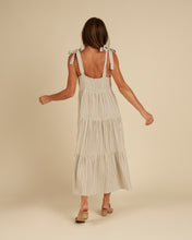 Load image into Gallery viewer, A cream and blue stripe linen blend featured on a maxi dress with tiers and a tank strap.

