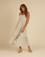 Load image into Gallery viewer, A cream and blue stripe linen blend featured on a maxi dress with tiers and a tank strap. 
