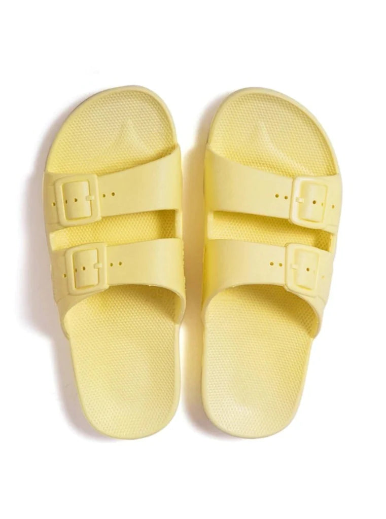 Yellow two strap baby and children sandals with a fixed buckle.