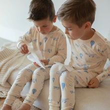 Load image into Gallery viewer, Beige baby two-piece pyjamas with a planes all over print.
