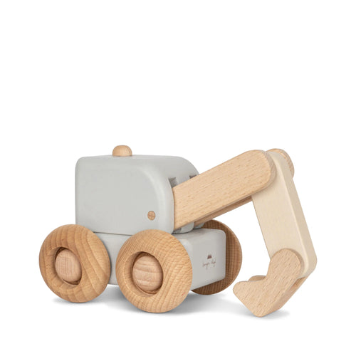 Wooden toy digger featuring a pastel blue and four wheels. 